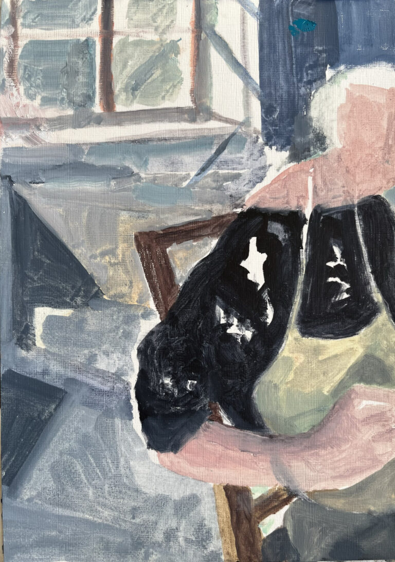artist seated with window behind